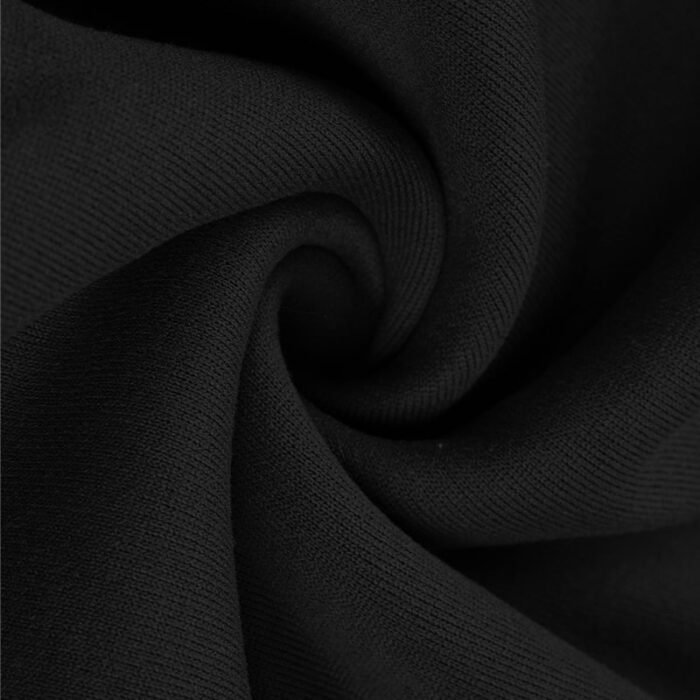 Close-up of black activewear fabric, swirled to show soft, thick texture and quality weave for sweatpants or joggers