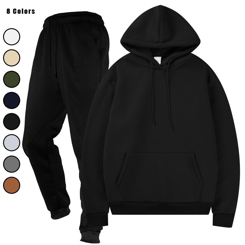 Stack of folded hooded sweatshirt and jogger sweatpants sets in multiple colors, including black, dark grey, light grey, and beige.