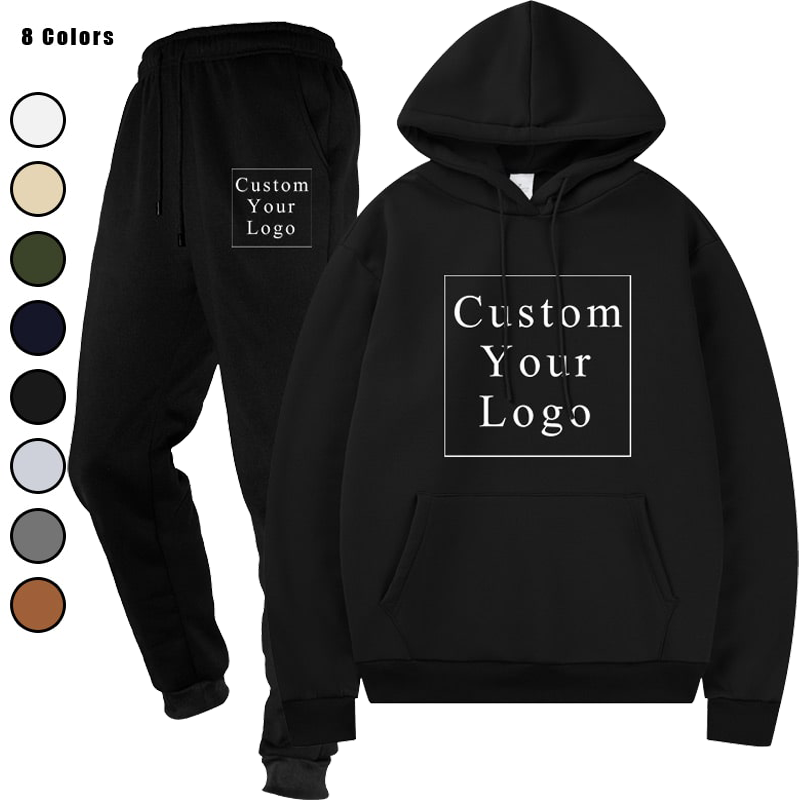 Stack of folded hooded sweatshirt and jogger sweatpants sets in multiple colors, including black, dark grey, light grey, and beige.