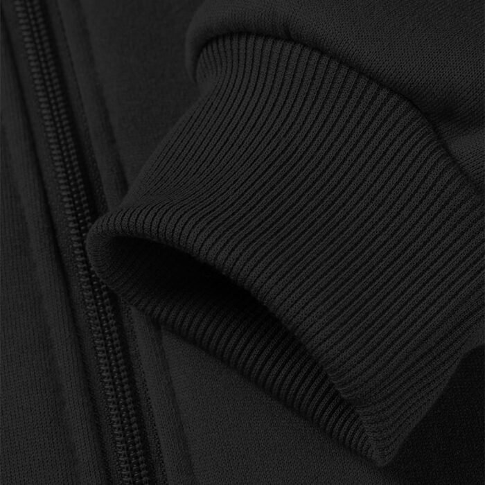 Close-up of the ribbed cuff on the sleeve of a black zip-up hooded sweatshirt, showing the textured knit.