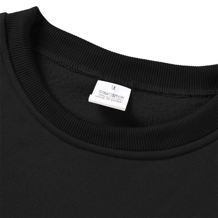Close-up of the ribbed cuff on the sleeve of a black crewneck sweatshirt, part of a Crewneck Sweatshirt Set.