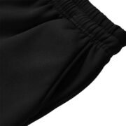 Close-up of 250G black jogger pants side pocket entry with smooth stitching