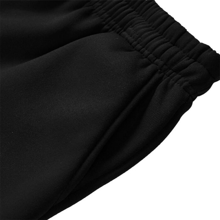 Close-up of 250G black jogger pants side pocket entry with smooth stitching