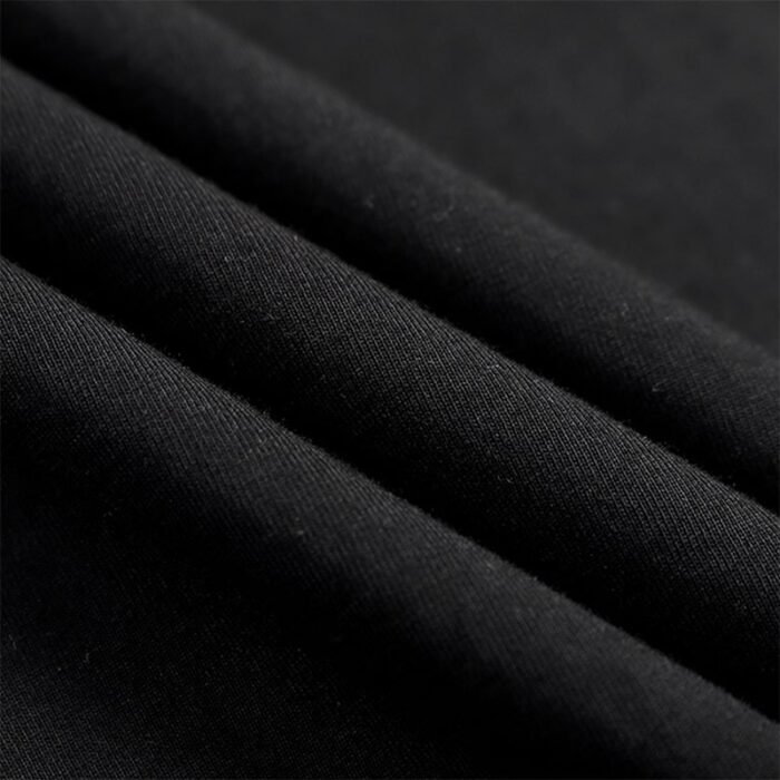 Close-up of Black T-shirt Fabric Texture - Soft and Smooth Material