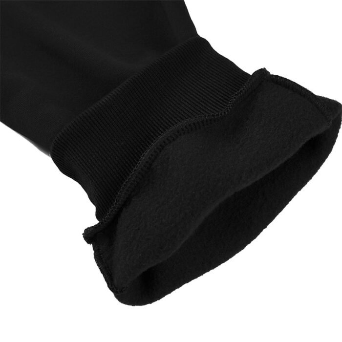 Close-up of 250G black jogger pants ribbed ankle cuff showing soft brushed fleece lining inside