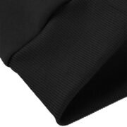 Close-up of the plush, brushed fleece lining inside a black crewneck sweatshirt, part of a Crewneck Sweatshirt Set.