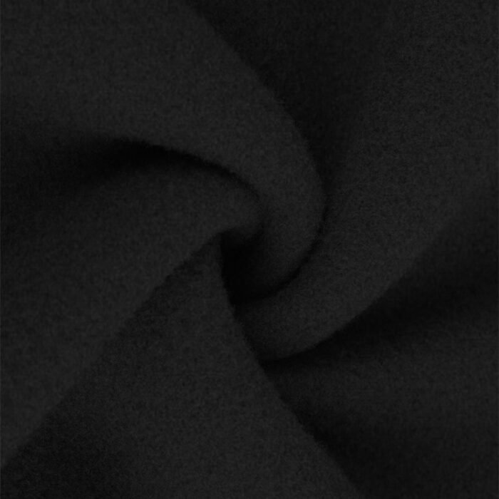 Close-up of the ribbed hem at the bottom of a black crewneck sweatshirt, part of a Crewneck Sweatshirt Set.